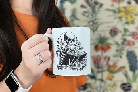 A skeleton reading Book svg, Book lover svg, Reader Bookish svg, Book with flowers svg files SVG DesignDestine 