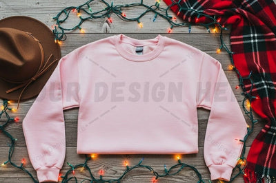Cozy pink cropped sweatshirt with holiday decor Mock Up Photo Designangry 