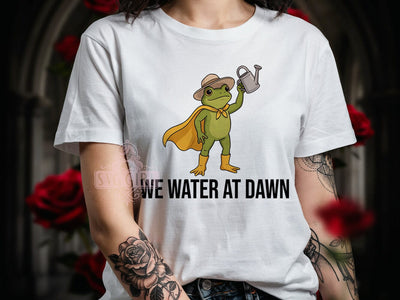 Frog Hero Warrior T-Shirt PNG, Safari Hat, Yellow Cape, WE WATER AT DAWN, Sublimation PNG, Cartoon Frog, Garden Warrior Sublimation SvggirlplusArt 