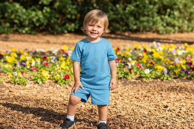 Kids' blue t-shirt mockup in flower field Mock Up Photo Designangry 
