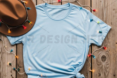 Light blue t-shirt mockup with hat and decorative lights Mock Up Photo Designangry 