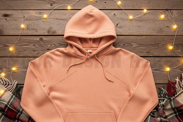 Peach hoodie on rustic wooden background Mock Up Photo Designangry 