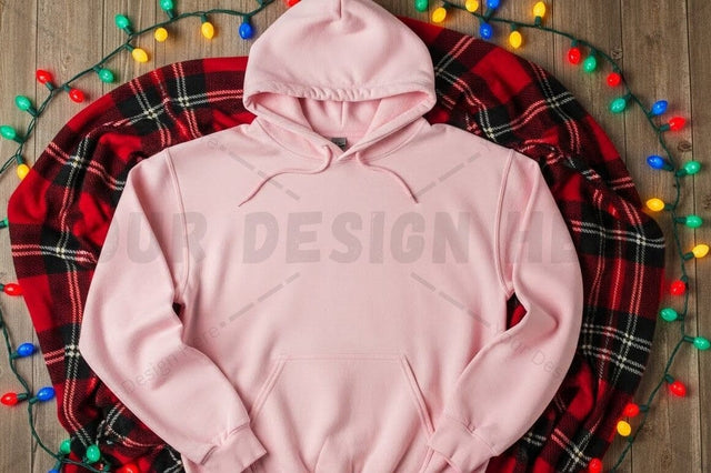 Pink hoodie on plaid blanket with christmas lights Mock Up Photo Designangry 