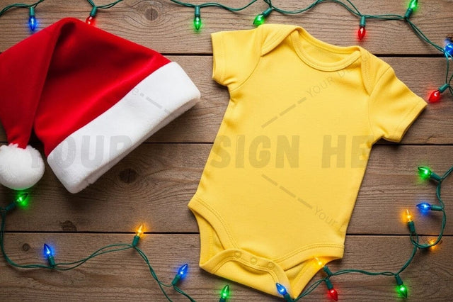 Yellow baby onesie with santa hat and christmas lights Mock Up Photo Designangry 