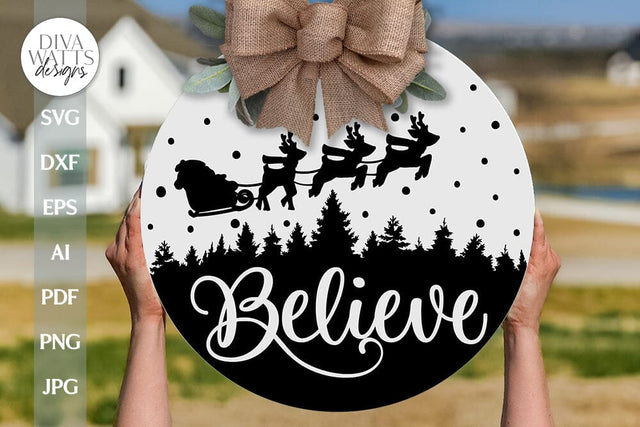 Believe SVG | Santa in Sleigh With Tree Silhouette Design SVG Diva Watts Designs 