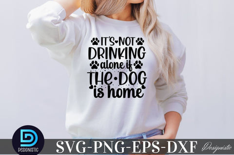 It's not drinking alone if the dog is home SVG SVG DESIGNISTIC 