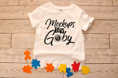 Kids White T shirt,Puzzle pieces, Flat Lay Mockup Mock Up Photo ArtStudio 