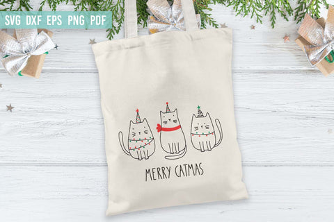 Merry Catmas SVG, Funny cartoon Merry Christmas cats SVG SVG Irina Ostapenko 