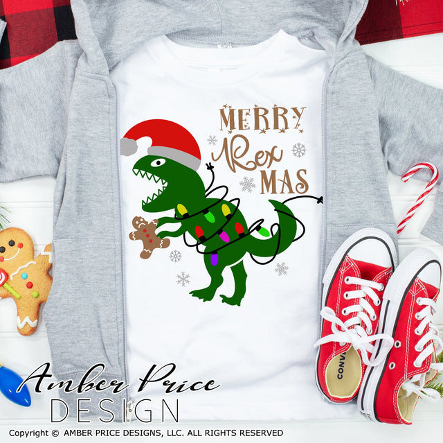 Merry Rexmas SVG | Dinosaur with Christmas lights SVG PNG DXF | Kid's Christmas shirt SVG | Christmas T-Rex SVG SVG Amber Price Design 