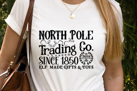 North Pole Trading Co.since 1850 Santa Approved Elf Made Gifts & Toys SVG Angelina750 