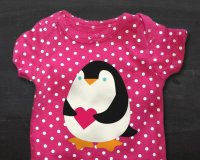 Penguin Holding Heart SVG Designed by Geeks 