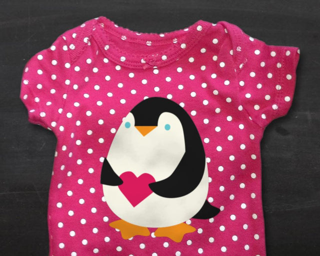 Penguin Holding Heart SVG Designed by Geeks 