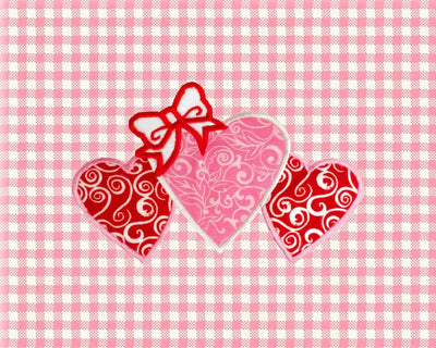 Trio of Hearts with a Bow Applique Embroidery Embroidery/Applique Designed by Geeks 