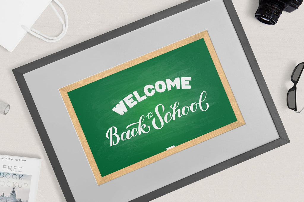 Welcome Back to school hand lettering on green board with wooden frame ...