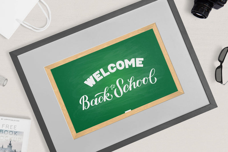 Welcome Back to school hand lettering on green board with wooden frame ...